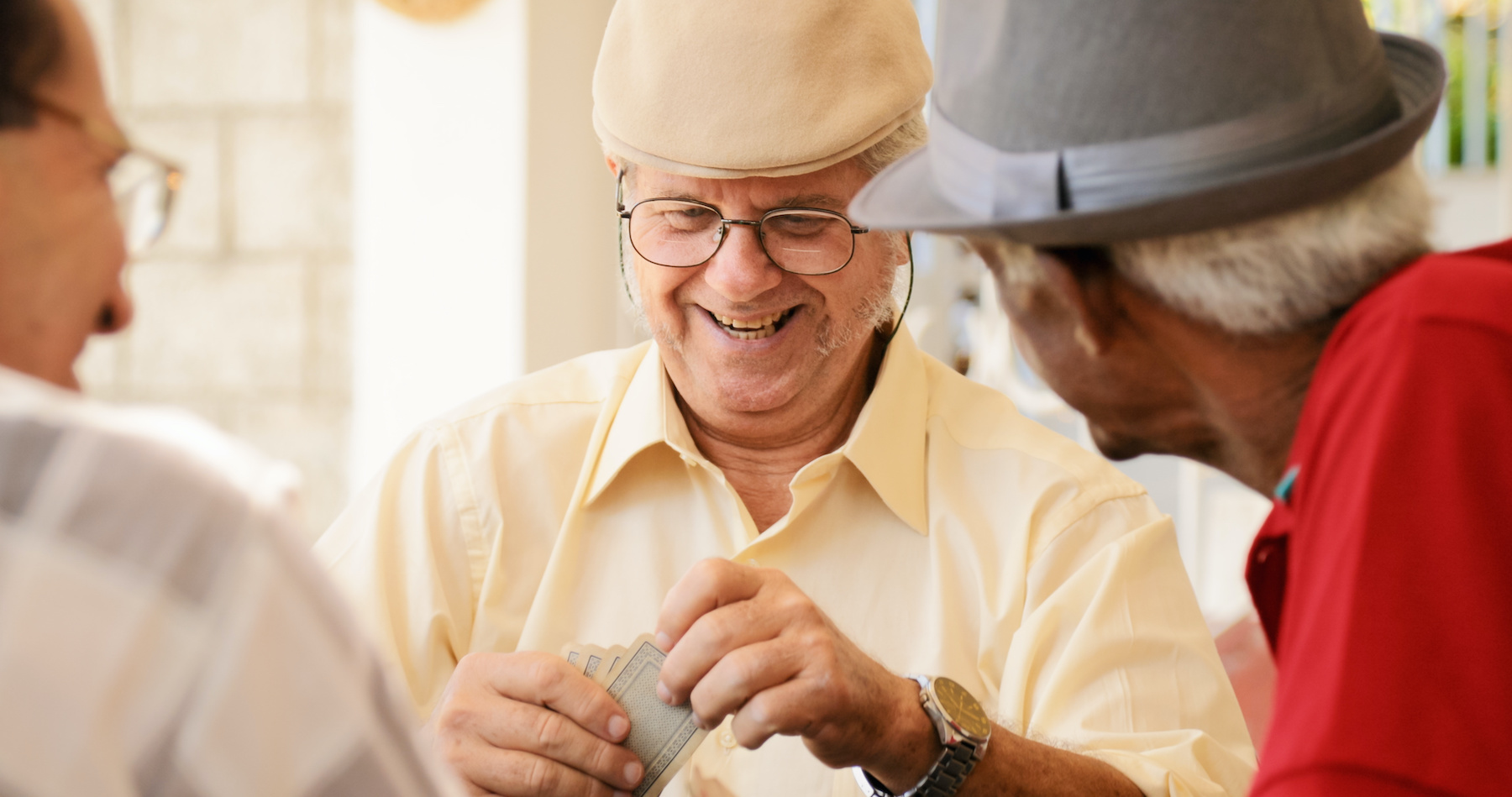 Senior man playing cards