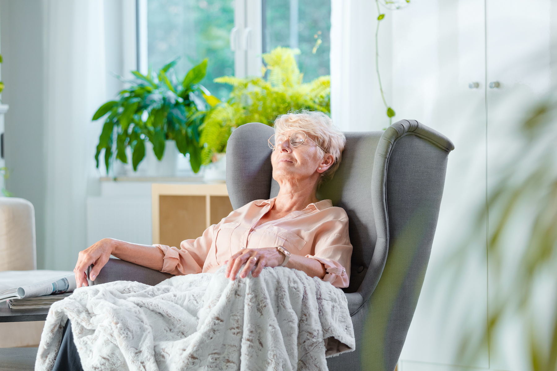 Senior woman resting in chair