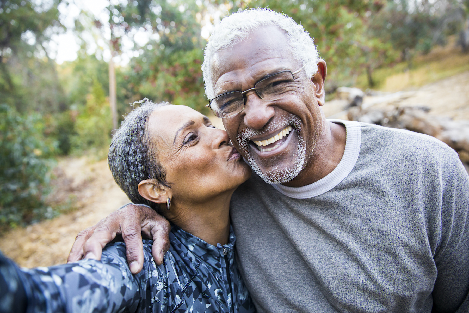 A beautiful senior African American Couple takes a selfie during their workout