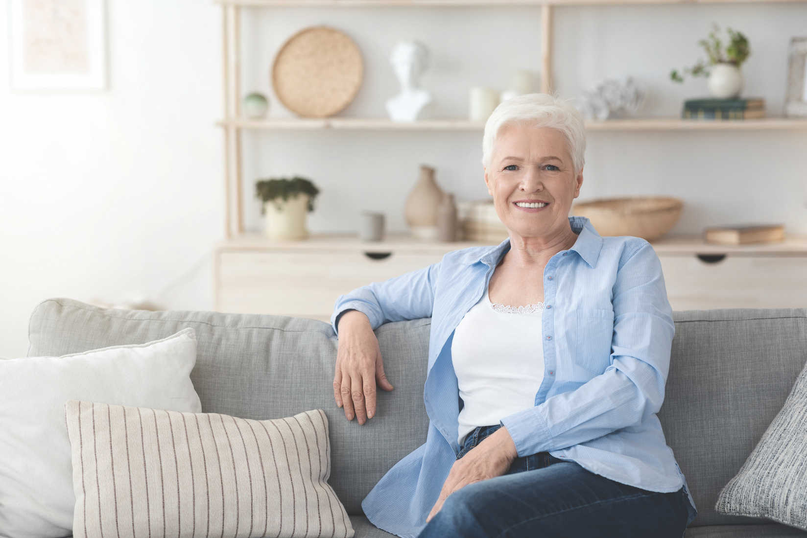 Relaxed Elderly Woman Posing On Couch