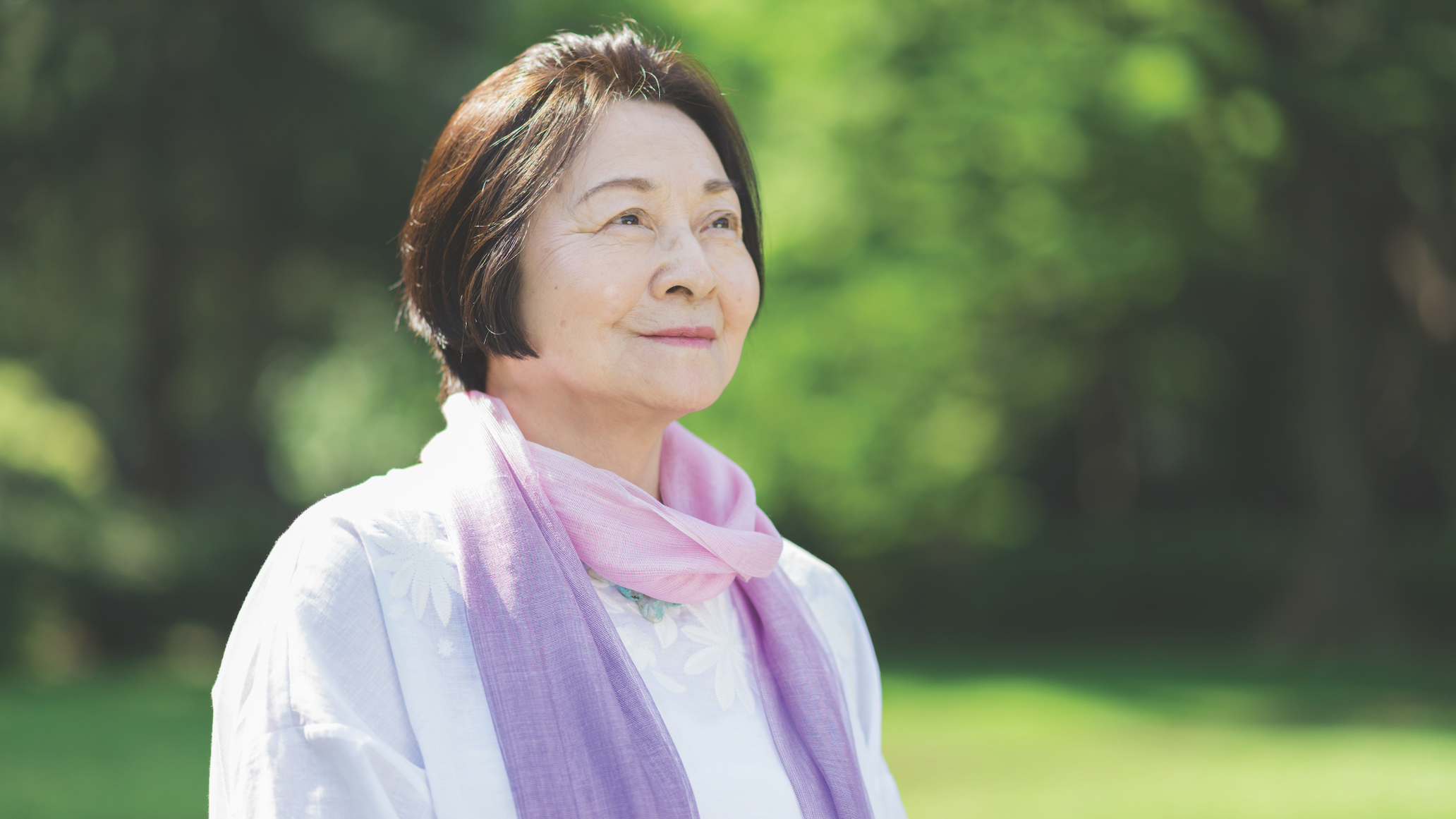 Asian senior woman outside