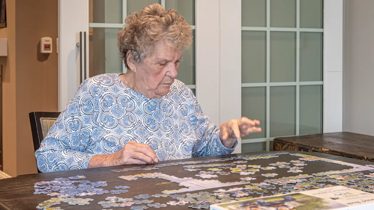 Laurel resident putting together a puzzle