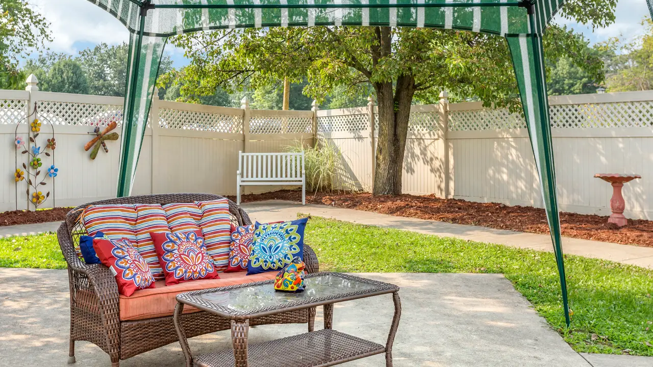 Hillsboro courtyard with awning and patio furniture