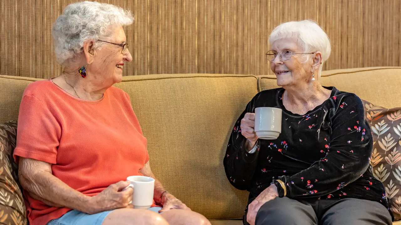 St. Pauls residents talking and drinking coffee