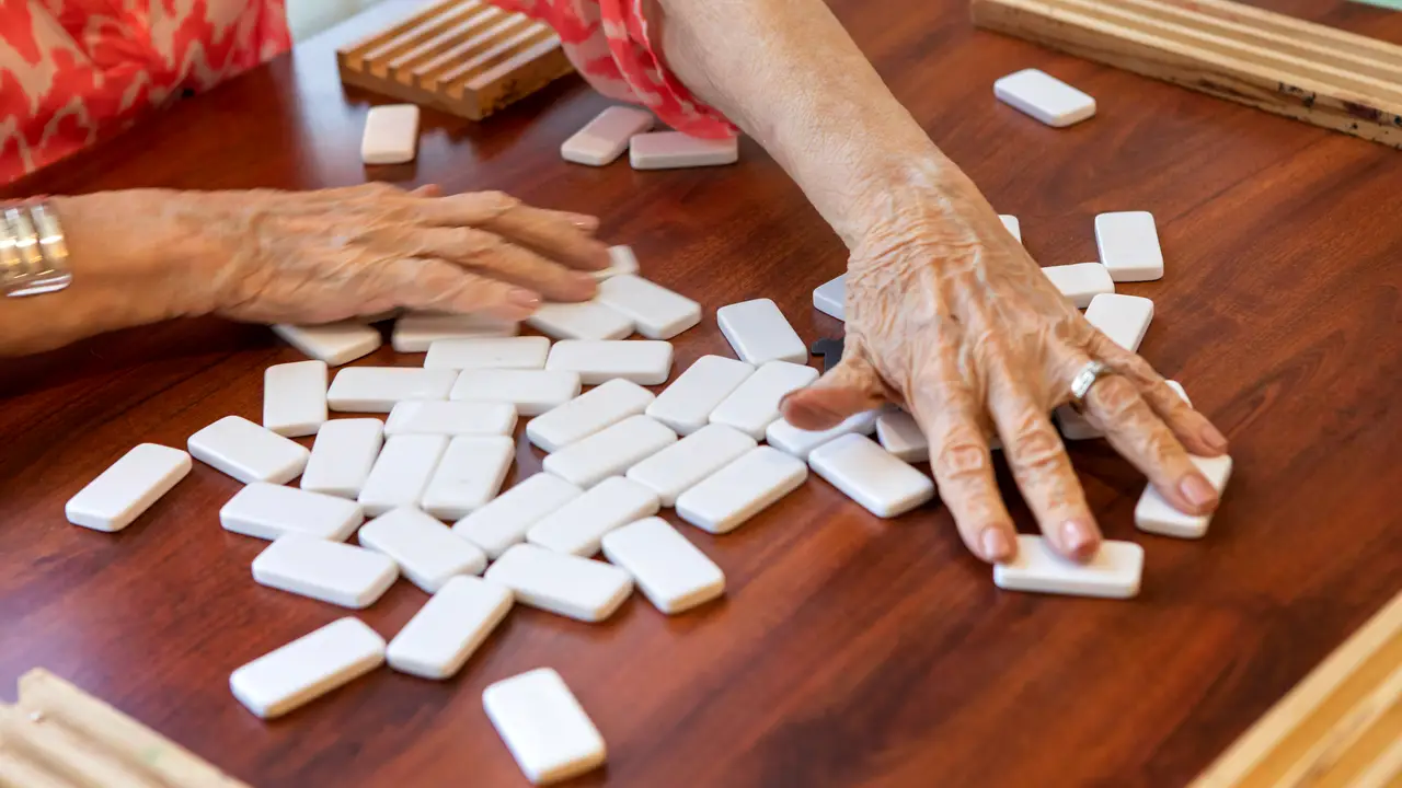 Country Gardens resident playing dominos