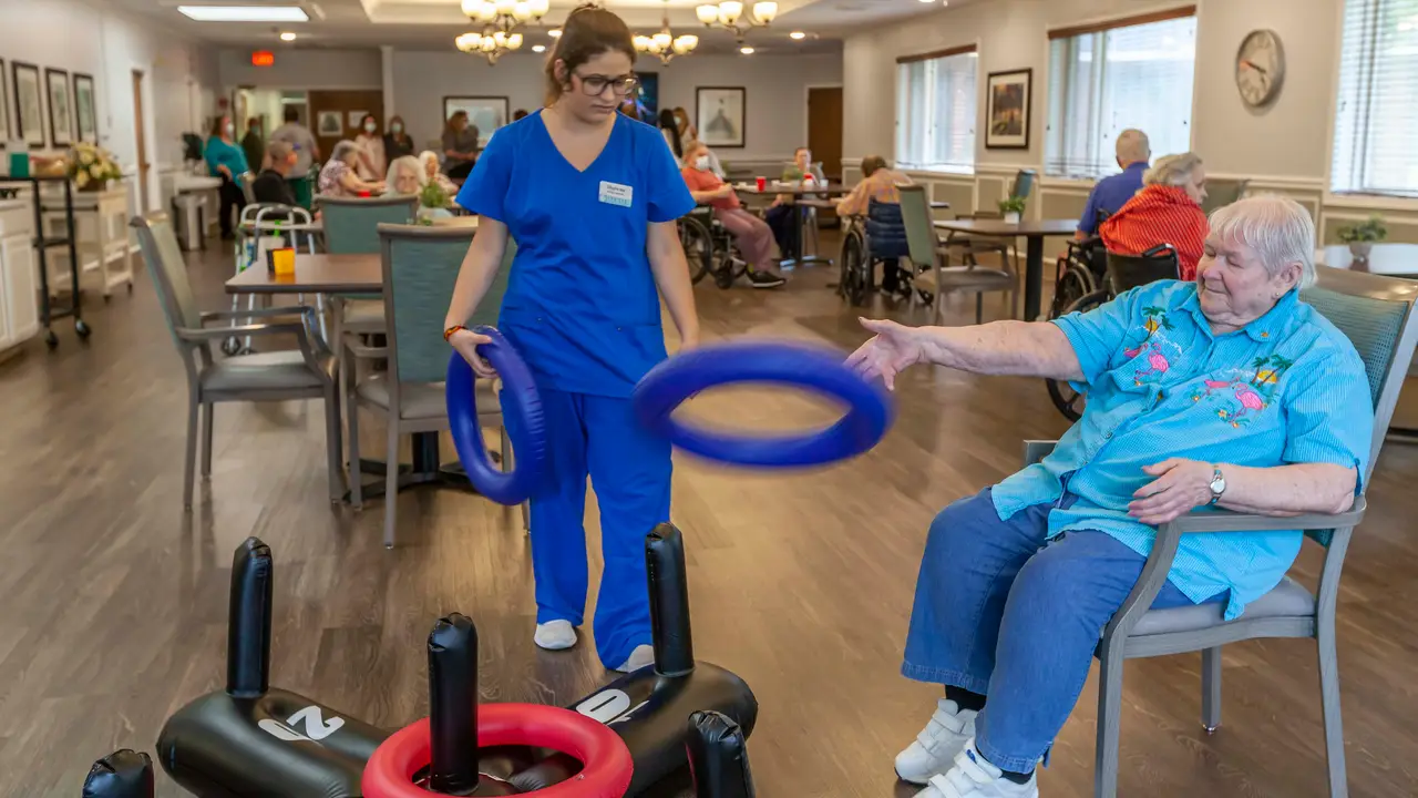 Dixon patient playing ring toss with therapist