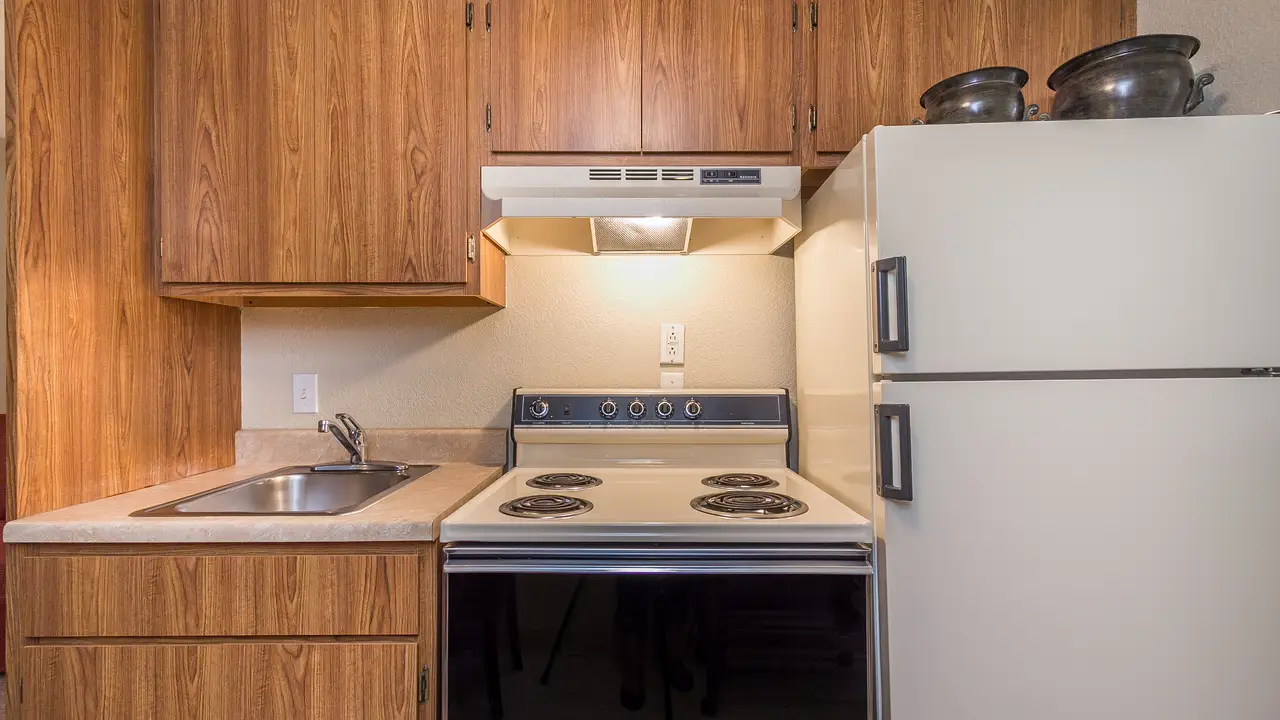 Victory apartment kitchen with full size stove and fridge