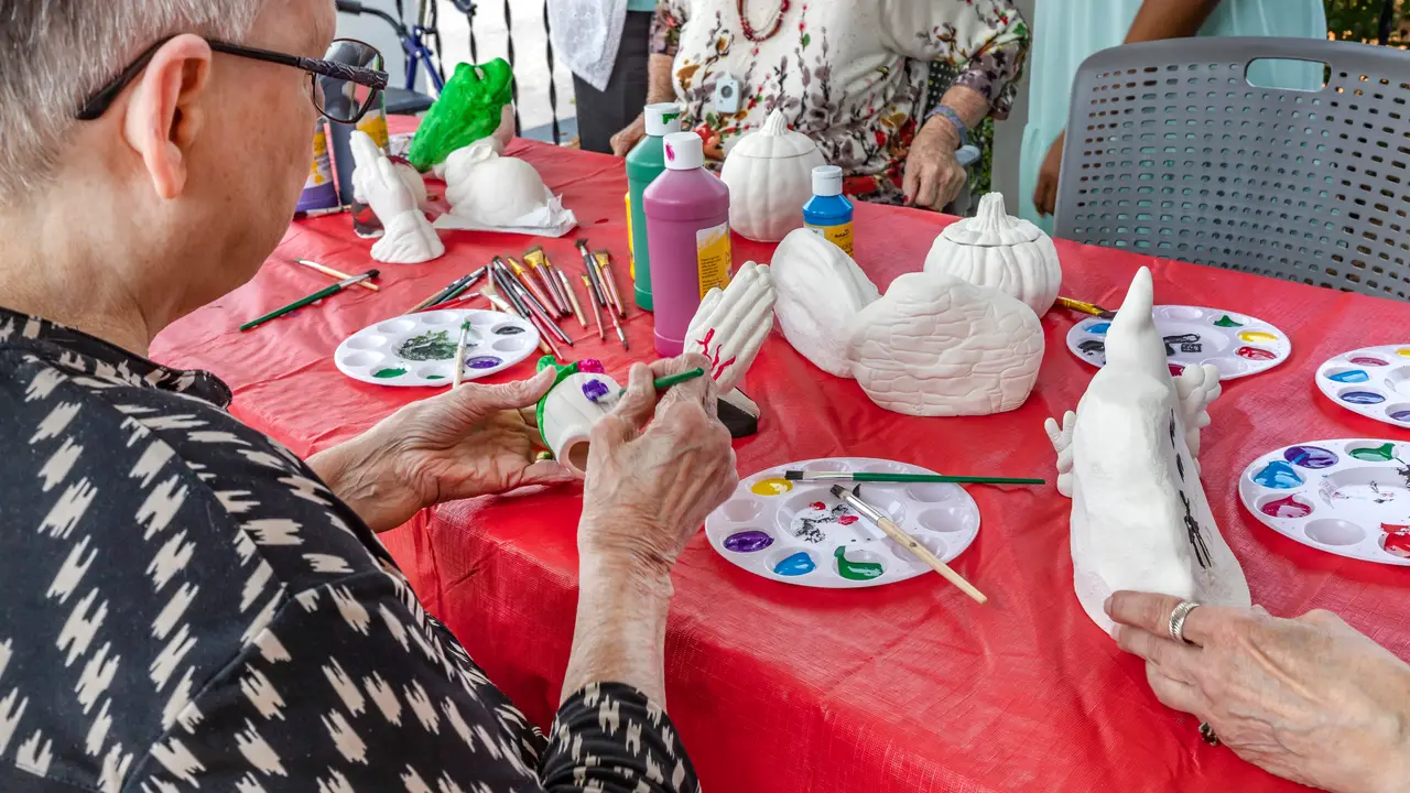 Wesley residents painting ceramics
