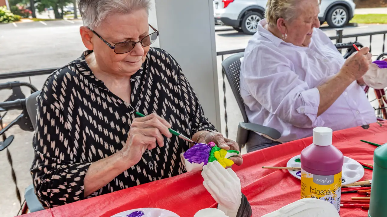 Wesley residents painting ceramics