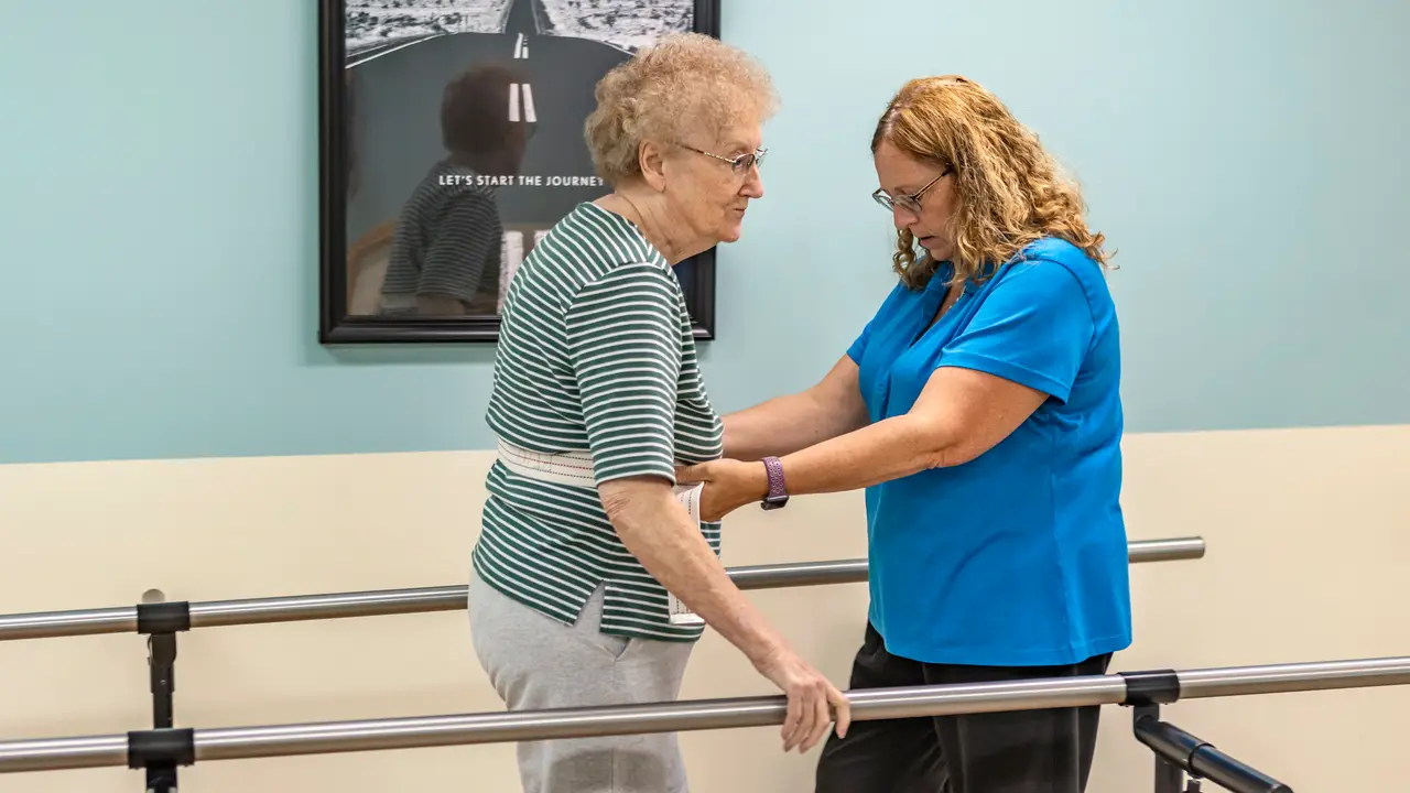 Hillsboro therapist helping patient walk with gait belt