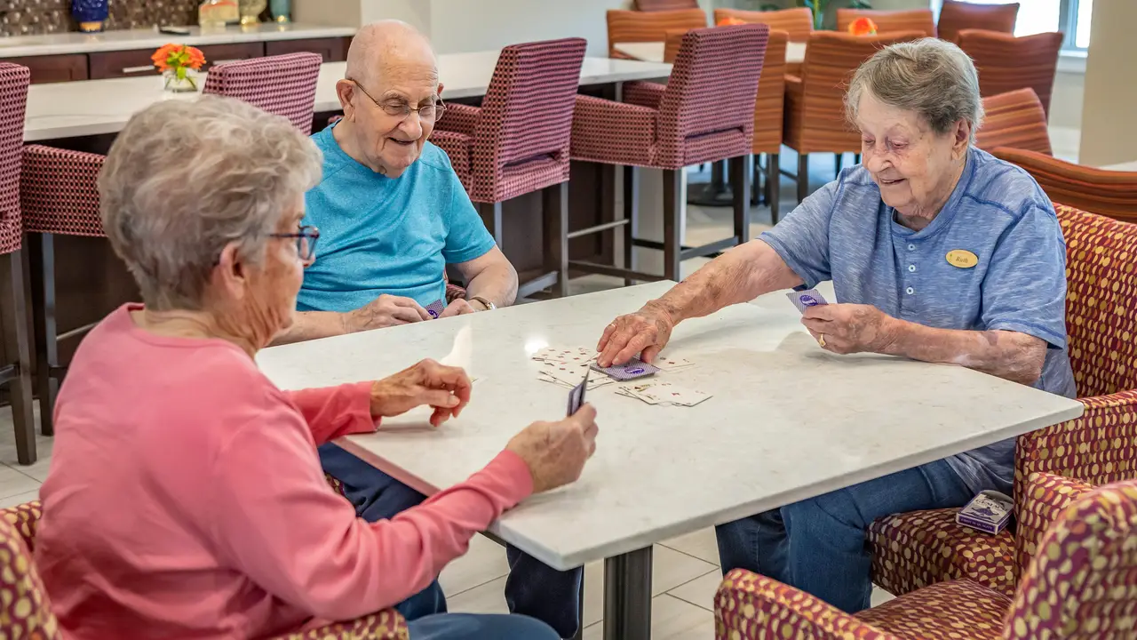 Tiffany Springs residents playing cards in dining room