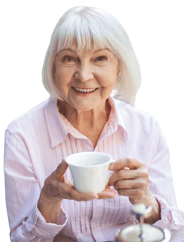 Senior female resident drinking tea