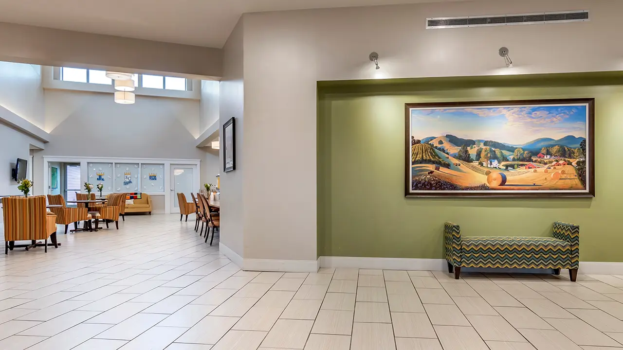 Large foyer with painting and windows
