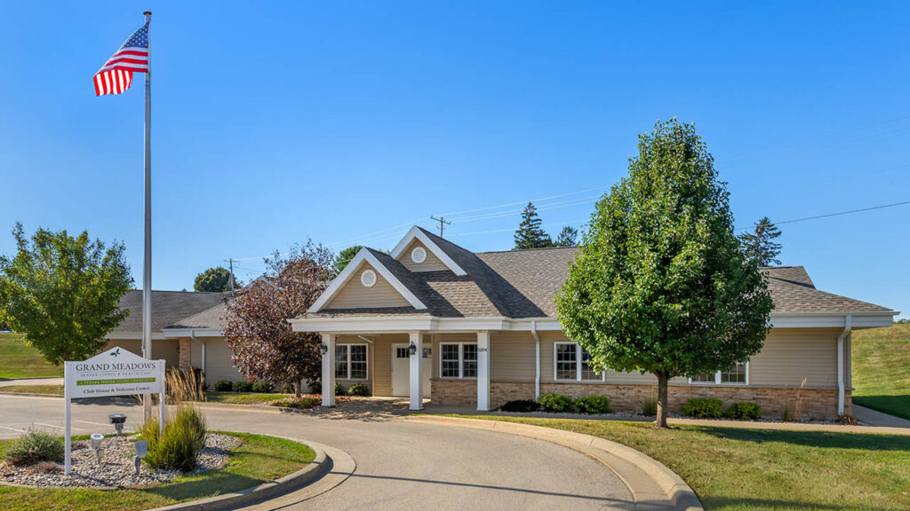 Single-story senior living townhomes and manicured grounds at Grand Meadows Senior Living in Asbury, IA, Dubuque County.