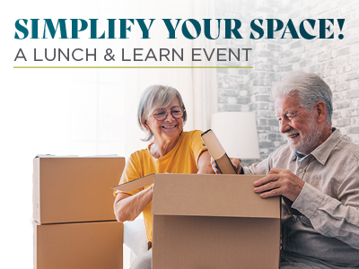 Smiling older couple packs cardboard boxes in a bright living room. Text reads, 