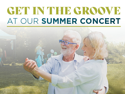 An older couple smiles and dances outdoors at a summer concert event, with people and a tent visible in the background. The text reads, 