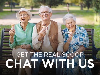 Three elderly people are sitting on a bench in a park, smiling and holding ice cream cones. The text overlaid on the image reads, 