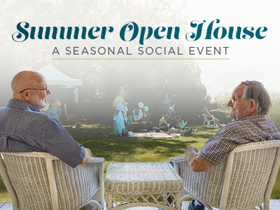 Two elderly men sit on white wicker chairs, facing each other outdoors. In the background, people gather on a lawn under trees. Text reads: 