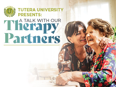 Two women sit closely and laugh together in a warmly lit room. The text reads,