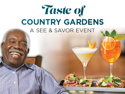 A smiling older man sits beside a tray with two colorful cocktails and small appetizers. Above him, text reads: