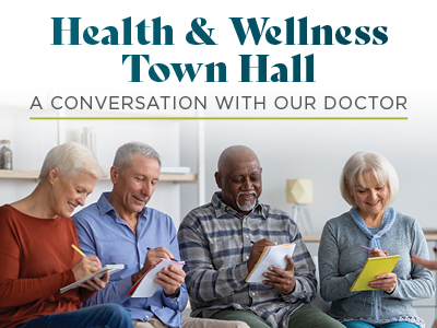 Four older adults sit together, smiling and writing on notepads. The text above them reads: "Health & Wellness Town Hall: A Conversation with Our Doctor." The warm, inviting setting highlights community life at Assisted Living Muskogee.
