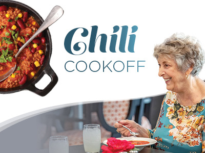 A smiling older woman sits at a table eating chili, with two glasses of water nearby. A pot of chili with herbs is in the top left corner. The text reads