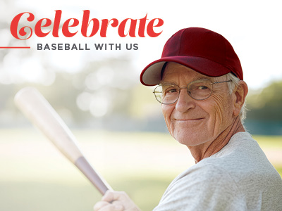 Smiling older man in a red baseball cap holding a baseball bat, standing on a field. Text above reads, 