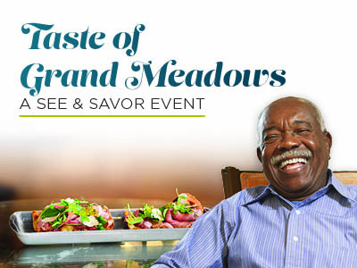 A smiling man sits at a table with a plate of gourmet food. The text above him reads,