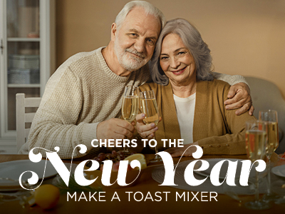 An elderly couple smiles while clinking glasses of champagne at a table set for a celebration. The text reads, 