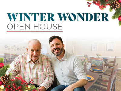 Two men, one older and one younger, smiling and sitting together in a decorated dining area. The text reads 