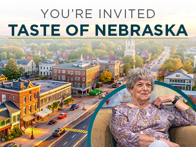 A cityscape of a small Nebraska town at sunset with text reading 