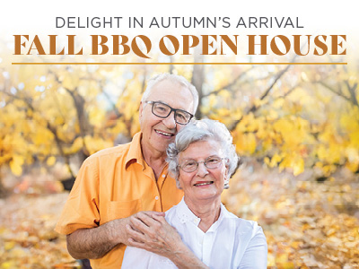 Smiling elderly couple embraces outdoors with autumn leaves in the background. Text reads, 