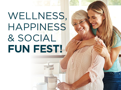 An older woman and a younger woman smile and embrace in a bright kitchen. The older woman is holding a coffee mug. The text reads, WELLNESS, HAPPINESS & SOCIAL FUN FEST