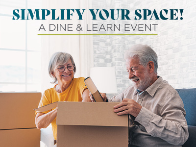 An older woman and man smile while unpacking a cardboard box in a bright living room. Text above them reads, 