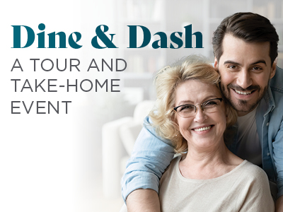 Smiling older woman with glasses and a younger man hugging her from behind. Text reads “Dine & Dash: A Tour and Take-Home Event.” Background is a softly lit Memory Care living room.
