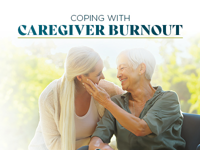 A younger woman lovingly touches the face of an older woman in a wheelchair, both smiling warmly. Text above them reads