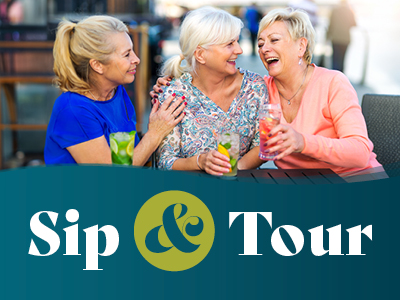 Three women sit outdoors, smiling and laughing while holding colorful drinks. The text