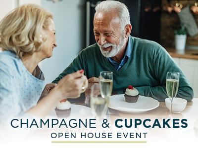 An elderly couple sits at a table enjoying cupcakes and glasses of champagne, smiling and engaged in conversation. Text at the bottom reads, 