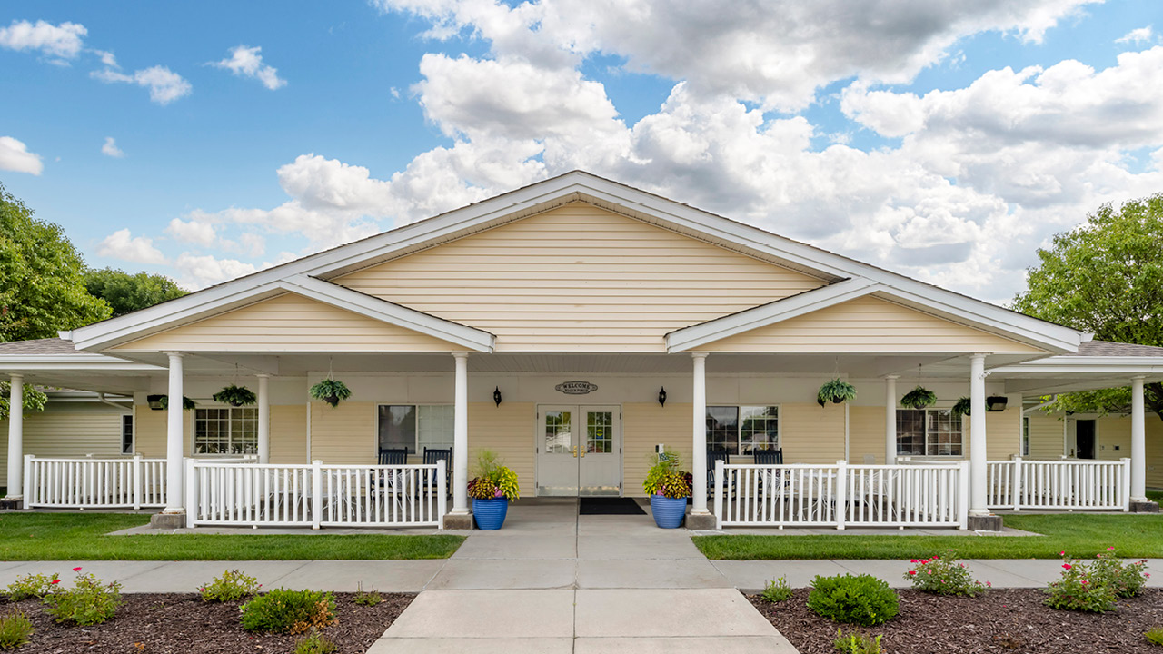 Homelike assisted living building with a central community gazebo at Cottonwood Senior Living in Columbus, NE, Platte County.