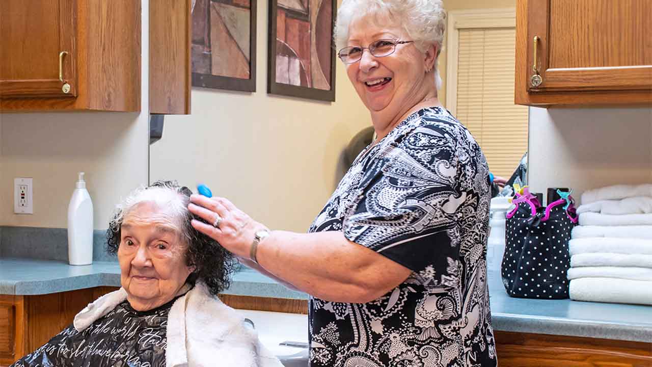 Resident getting hair done at Floyd Senior Living