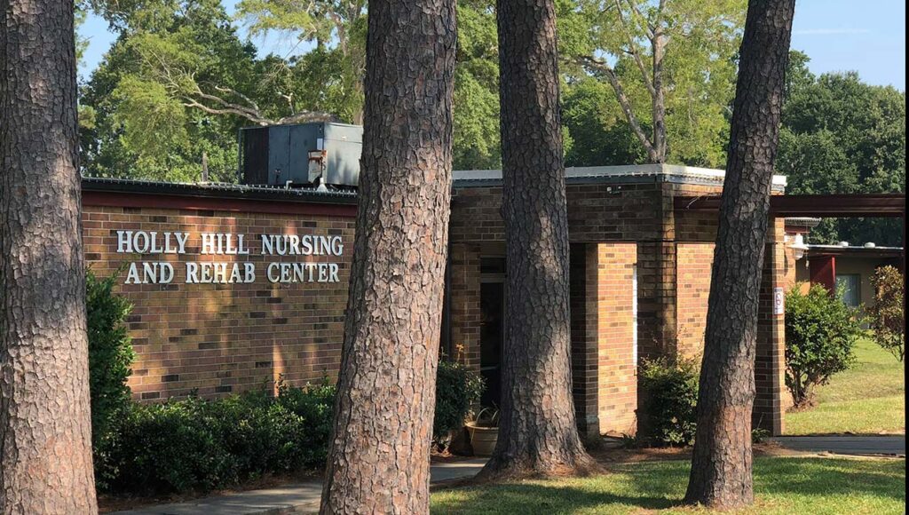 A brick building with a sign reading 