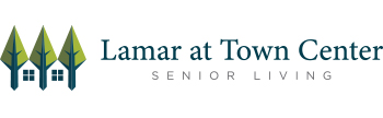 Logo for Lamar at Town Center Senior Living. It features stylized green trees with blue trunks resembling houses, followed by the text 
