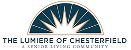 lumiere-chesterfield-logo-v2 Logo for The Lumiere of Chesterfield, a senior living community, featuring a stylized sunburst above the name in blue and gold text—representing premier Senior Living in Chesterfield, MO.