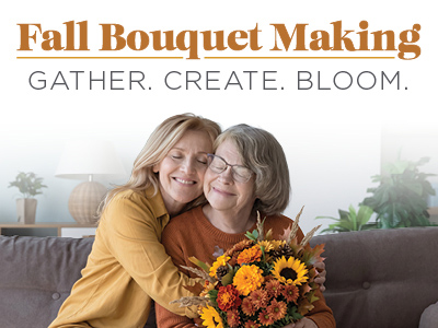Two women sit on a couch, hugging and smiling while holding a vibrant fall bouquet of sunflowers and orange flowers. Text reads: “Fall Bouquet Making. Gather. Create. Bloom.”.