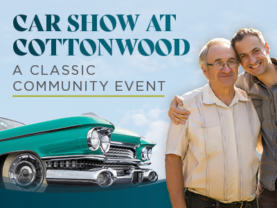 Two people stand arm in arm smiling next to a green vintage car. Text reads: