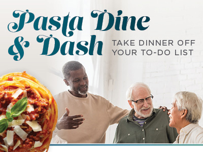 Three smiling people chat together indoors near a window. Text reads “Pasta Dine & Dash. Take dinner off your to-do list.” A plate of pasta with sauce and basil is in the foreground.