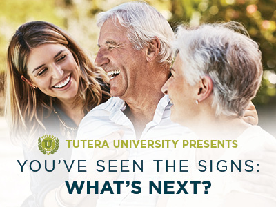 Three smiling adults, two older and one younger, sit close together outdoors. Text reads: “Tutera University Presents: You’ve Seen the Signs: What’s Next?”—an informative session on Assisted Living & Memory Care.