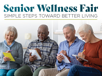Four smiling older adults sit in a row, writing on notepads. Above them, text reads: