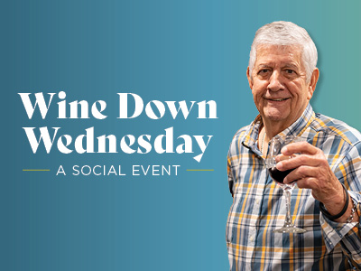 An older man in a plaid shirt holds a glass of red wine and smiles. The text beside him reads, "Wine Down Wednesday: A Social Event," celebrating community in Assisted Living & Memory Care, on a blue-green gradient background.