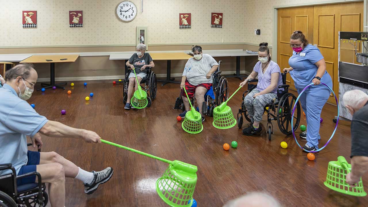 Meridian senior residents play a game in common room
